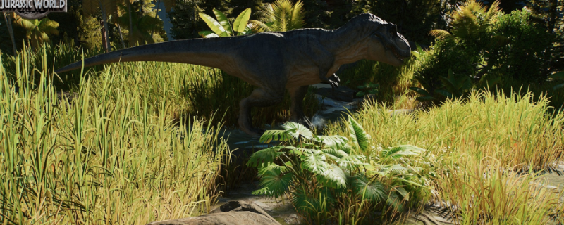 《侏罗纪世界：进化3》游戏内实机画面：三只巨型暴龙昂首矗立于火山地貌围栏中，岩浆微光映照鳞甲，背景可见游客观景台与警示红灯闪烁